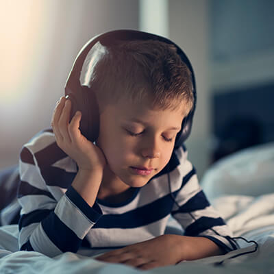 A boy wearing headphones